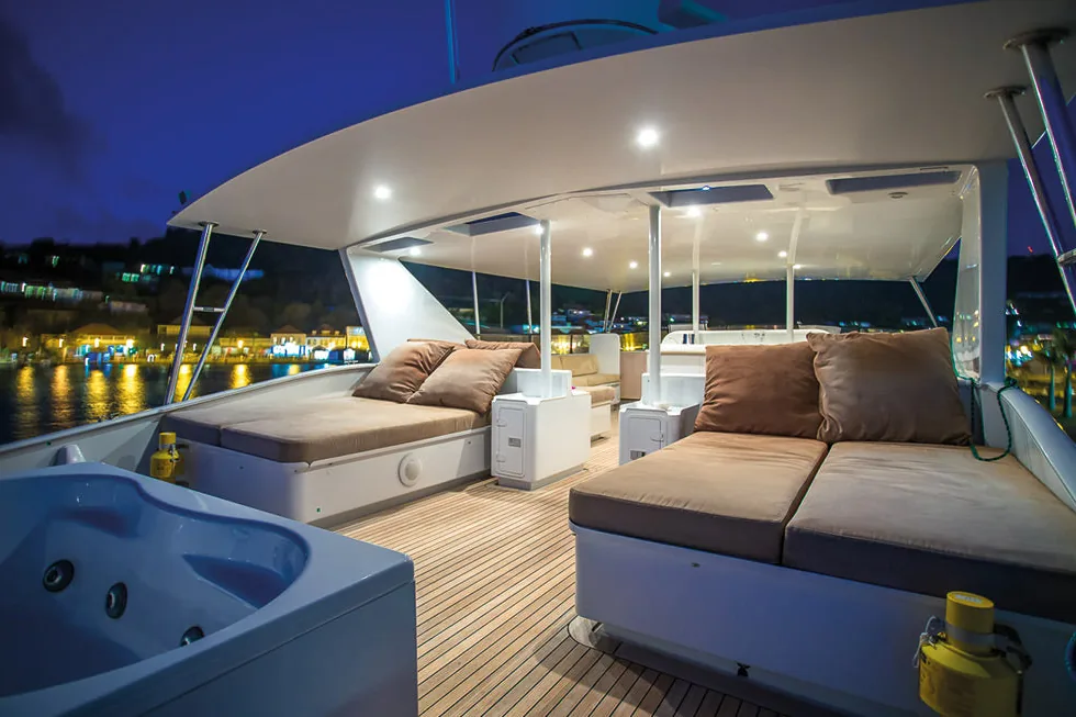 Broward 100 sun deck jacuzzi above the lights of Gustavia