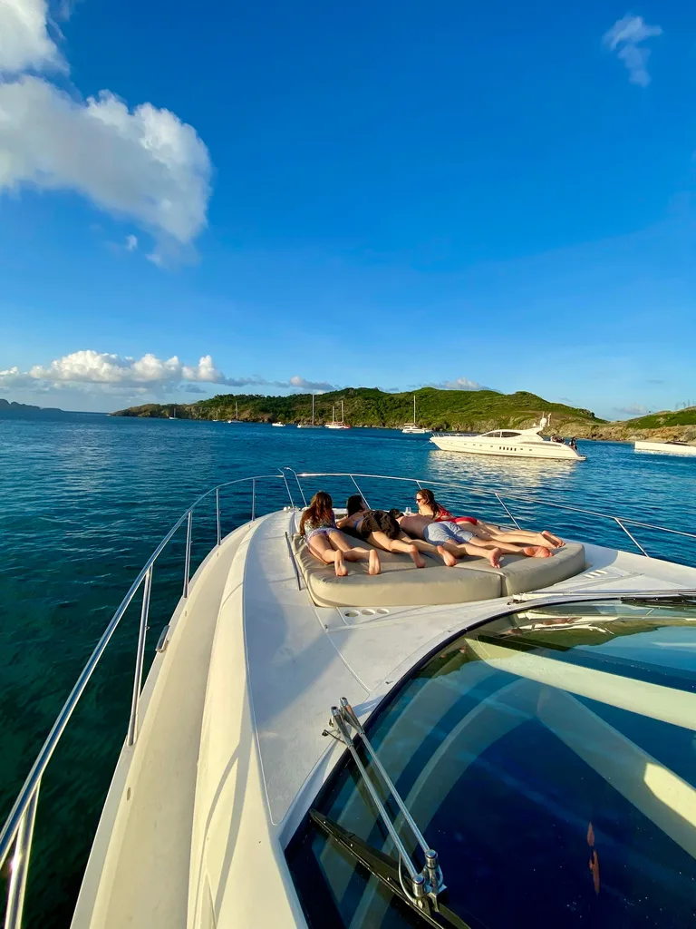 Sunseeker Predator 64 bow sun pad at anchor