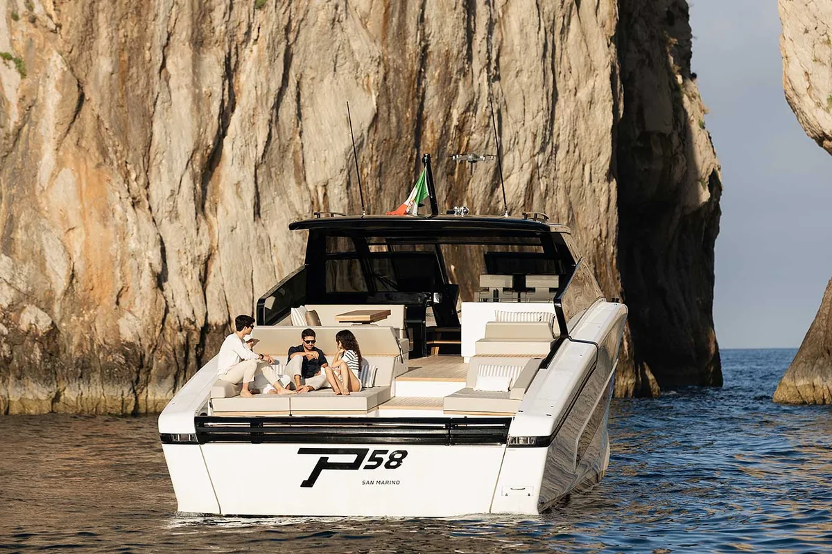 Fiart 58 at anchor below a rock face